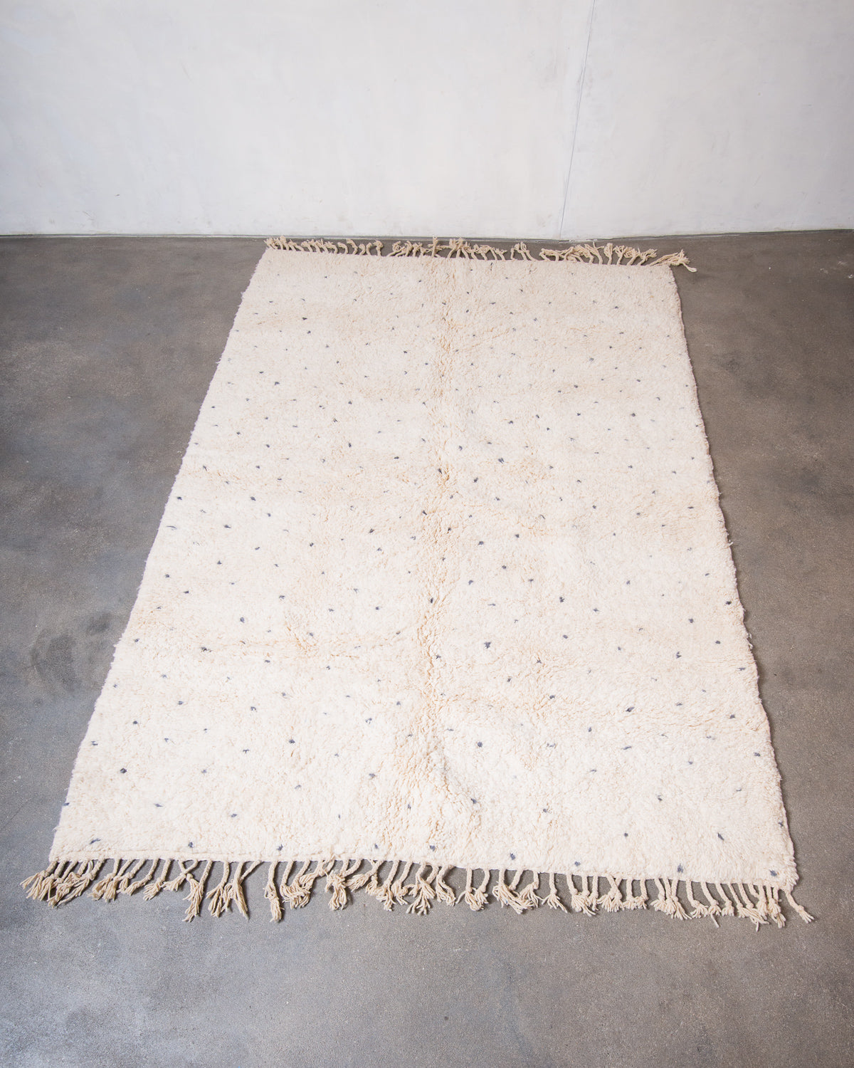 Modern, designer, handcrafted Berber rug from Morocco. Beniourain carpet with minimalist design, natural wool pile and a fluffy texture.
